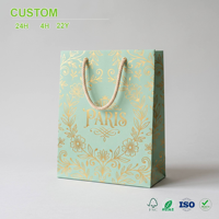 Bolsa de Regalo Verde Menta Personalizada con Diseño Floral Dorado y Asas de Cuerda para Exhibición en Tiendas, Empaquetado al por Mayor