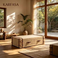 Table basse de rangement rembourrée de style coffre avec deux tiroirs et détail de sangle décorative pour salon