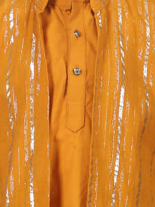 Niño sonriente con kurta naranja tradicional y pantalones blancos, posando en interiores, ropa étnica festiva, retrato de niño feliz - Product Image 4