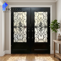 Porte d'entrée haut de gamme en noir mat avec accents dorés et inserts en verre transparent pour résidence haut de gamme