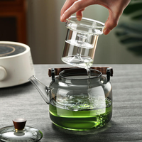 Théière moderne en verre borosilicate avec poignée en bois, compatible cuisinière, 1100 ml, transparente, gris fumé, avec infuseur amovible pour thé et fruits