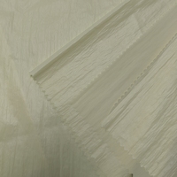 Tissu en taffetas froissé de nylon 20D semi-transparent, doux, chaud et respirant avec finition cirée pour doudounes et sacs d'hiver