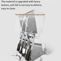 Machine de remplissage par gravité à 4 becs pour vins, spiritueux et jus de fruits dans des bouteilles en verre ou en plastique