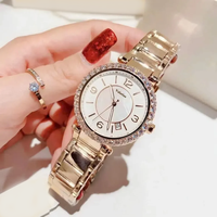 Montre élégante pour femmes, boîtier rond en cristal, cadran en nacre, date, bracelet en acier inoxydable, lunette en strass, montre-bracelet pour dames