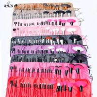 Vente en gros de pinceaux de maquillage professionnels de luxe à bas prix, étiquette privée, 24 pièces, faits à la main, personnalisés, avec sac d'emballage