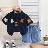 Petit garçon été nouvel ensemble dessin animé revers à la mode à manches courtes deux pièces ensemble bébé mignon ensemble en gros
