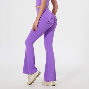 Pantalones de yoga acampanados sin costuras con cintura elástica alta, bolsillos traseros y efecto realce de glúteos, de color liso, en Spandex/Nylon - Product Image 3