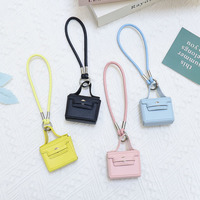 En gros, Mini sac de rangement portable en PU, porte-clés, breloque de clé à sangle de main couleur unie, pour sac à main, sac à dos, cadeau décoratif et tendance