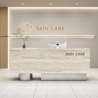 Comptoir d'Accueil Haut de Gamme Moderne en Pierre de Grotte Minimaliste avec Lumière LED en MDF pour Hôtel, Magasin de Vêtements et Salon de Beauté