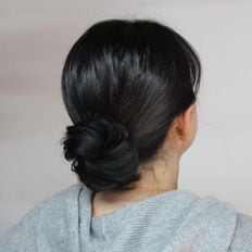 Accessori per capelli con cacca in rilievo nera - Product Image 1