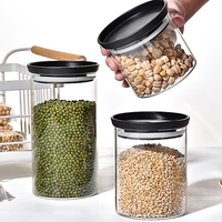 Vente en gros de bocaux de stockage en verre à haute teneur en borosilicate Taille personnalisée 450ml 700ml 1100ml Pot en verre de miel Couvercle en silicone pour le stockage des aliments
