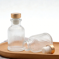 Bouteille diffuseur d'arômes en verre transparent rond vide de 50 ml avec logo personnalisé pour salle de bain