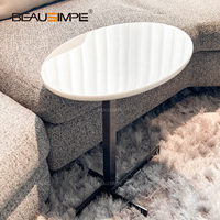 Table basse en acier massif avec finition brillante miroir superposée table esthétique à géométrie architecturale minimale