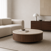Table basse ronde en travertin clair avec placage en bois foncé, style minimaliste pour salon