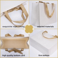 Sacs d'emballage en carton blanc avec poignée en ruban de luxe personnalisés, sacs en papier imprimés sur mesure avec votre propre logo