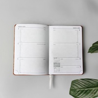 Journal planificateur en cuir à couverture rigide et personnalisée du fabricant Tapis de calendrier avec sangle élastique pour carnet de notes à couverture en PU