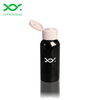 Xypackaging Flacon rond en PET plastique de luxe de 50 ml avec bouchon à bille pour les soins de la peau et les cosmétiques
