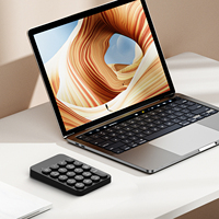 Keyboard numerik mini bulat ramping dan nyaman dengan mode ganda 2.4G dan BT untuk tablet, notebook, kantor, dan penggunaan di rumah.