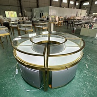 Vitrine à bijoux ronde haut de gamme en verre, comptoir d'exposition modulaire doré, aménagement intérieur de magasin de luxe