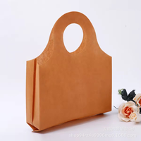 Sac fourre-tout en non-tissé épaissi avec poignée à trous ronds, sac cadeau de boutique haut de gamme, sac de rangement réutilisable pour exposition, vente en gros