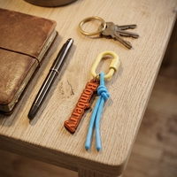 Nouvelle conception de porte-clés coloré avec boucle ovale et pendentif personnalisé, sangle tressée, breloque pour sacs à main et clés de voiture