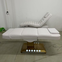 Table de massage électrique moderne dorée, lit de spa de luxe avec base dorée réglable, éclairage LED, pour hôtel, salon, usage médical, en cuir PU