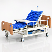 Lit médical à courbes intégrales avec manivelle manuelle, contrôle de descente progressionnelle, cadre en bois pour le positionnement des patients, usage quotidien en salle de soins