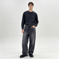 Jean élastique à taille élastique pour homme, en denim noir délavé, coupe ample à jambe large, avec cordon de serrage et ourlet retroussé sur les côtés, idéal pour le streetwear