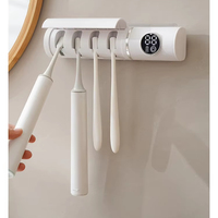 Stérilisateur de brosse à dents OEM stérilisation UV ultraviolet séchage à l'air boîte de désinfection de brosse à dents porte-brosse à dents de salle de bain