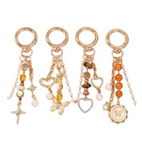 Nouveau porte-clés rond en alliage, breloque de sac en forme de croix, perles, papillon, cœur, très vendu
