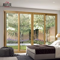 Porte coulissante sur mesure en aluminium et bois, pleine hauteur, avec grande vitre, ton chaud lumineux, pour jardin, terrasse, cour
