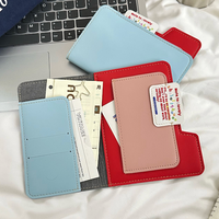 Porte-passeport en cuir PU bicolore tendance 2026 avec étui de voyage multifonctionnel pour cartes et sac de rangement pour billets