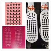 Vente en gros Logo personnalisé Designer Gym Chaussettes de sport Chaussettes antidérapantes antidérapantes Soccer Athletic Sport Football Grip Chaussettes