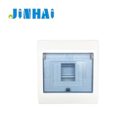 Boîtier de distribution encastré encastrable avec base métallique et porte en plastique mat, pour distribution électrique quatre fils