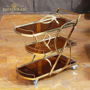 इतालवी आधुनिक लक्जरी गोल्डन स्टेनलेस स्टील रेस्तरां 3 टियर टेम्पर्ड ग्लास चाय की सेवा ट्रॉली - Product Image 2