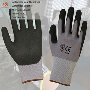 Guantes de Trabajo de Seguridad de Nailon y Elastano Gris sin Costuras de Calibre 15 con Recubrimiento de Nitrilo Arenoso Negro en la Palma - Product Image 1