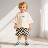 Conjunto de Camiseta y Pantalones Cortos de Algodón para Niños, Diseño Personalizado 2026, Estilo Oversize con Hombros Caídos, Estampado a Cuadros, Ropa Urbana para Niños Pequeños, Muestra OEM