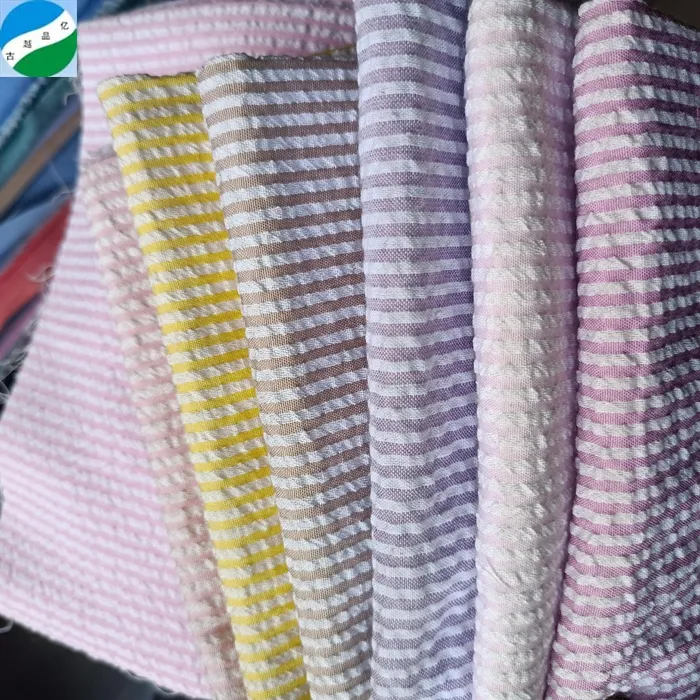 Shaoxing tekstili CVC pamuk ipliği boyalı dokuma kabarcık krep şerit kumaş stok lot baskı giyim için