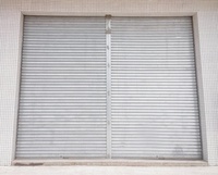 Porte à enroulement électrique en alliage d'aluminium moderne, pratique et sûre