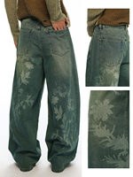 Jeans en denim délavé imprimé avec des éléments floraux gravés au laser vintage