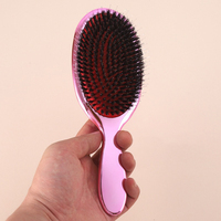 Brosse à cheveux à coussin d'air électrolytique avec poils de sanglier végétaliens démêlant la palette d'or rose pour un peigne droit bouclé We Dry