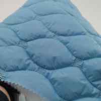 Tissu matelassé brodé respirant en nylon 100% de forme oignon personnalisé MQ au mètre pour vestes de garçons et de filles