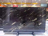 Dalles de granit noir Jet Mist Lactea Via Brazil pour plan de travail de cuisine avec veines noires et blanches, granit neige