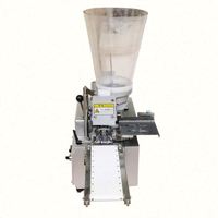 Machine à farcir et à emballer les tortellinis et les raviolis de différents poids