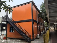Maison préfabriquée en conteneur SUBEI à double étage pour café, restaurant, avec toit en pente et mur-rideau en verre, bureau