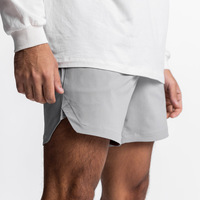 Aoyema OEM Camo Solid 2in1 Short de course pour homme Séchage rapide Double couche Respirant Élastique Short de sport pour homme avec poches