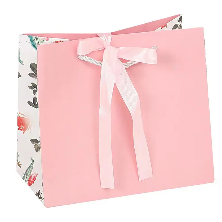 Sacchetto di carta Premium all'ingrosso con papillon sacchetto di imballaggio al dettaglio di abbigliamento di lusso sacchetto regalo di dimensioni personalizzate per il compleanno