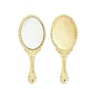 Vente en gros Miroir à main rétro ovale noir doré et argenté Miroirs cosmétiques Miroir de maquillage vintage de haute qualité pour femmes - Product Image 1