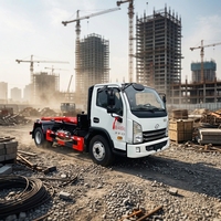 Camion compacteur à bras hydraulique SAIC Yuejin Blue Label Diesel Euro 3 avec benne à ordures interchangeable pour le transfert de déchets