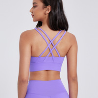 Soutien-gorge de sport uni sans bretelles à dos croisé, maintien moyen, respirant, léger, rembourré, antichoc, extensible dans quatre directions pour femme